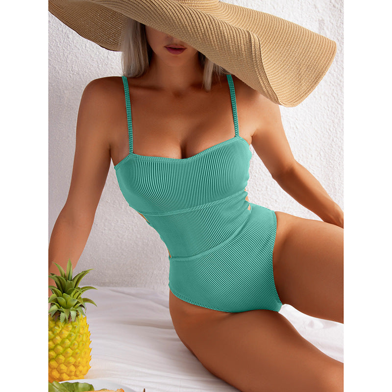 green one-piece swimsuit